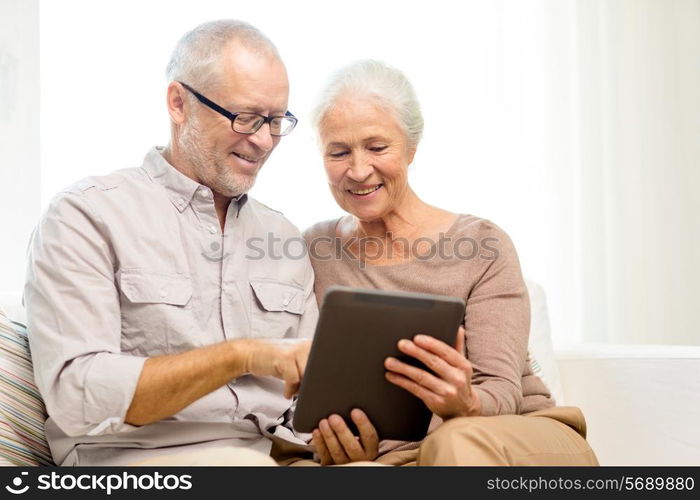 family, technology, age and people concept - happy senior couple with tablet pc computer at home