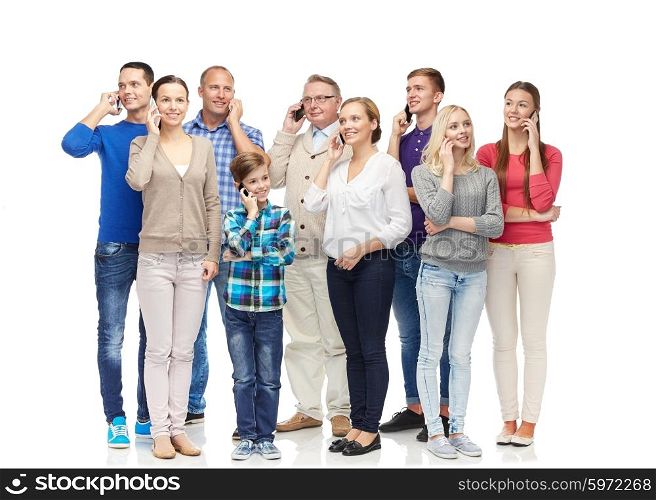 family, technology, generation and people concept - group of smiling men, women and boy with smartphones calling