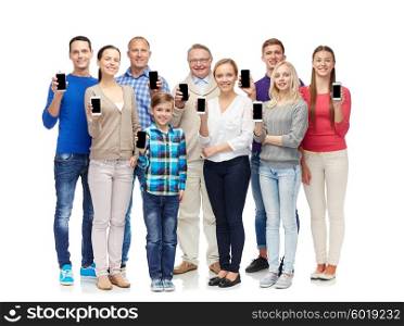family, technology, generation and people concept - group of smiling men, women and boy smartphones
