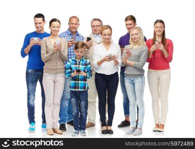 family, technology, generation and people concept - group of smiling men, women and boy with smartphones