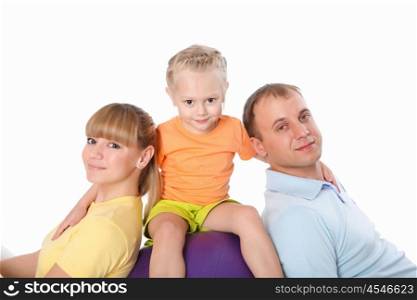 family together doing sport indoors in sportwear