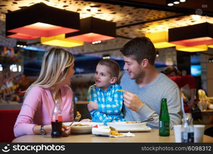 family together have break at lunch in shopping mall