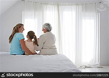 Family Together in Bedroom