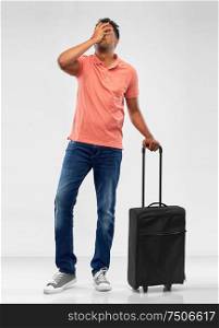 family, tourism and vacation concept - indian man in polo shirt with travel bag making face palm gesture over grey background. indian man with travel bag making face palm