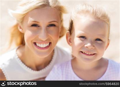 family, travel, vacation, adoption and people concept - happy mother and little daughter on summer beach