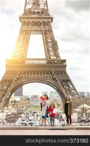 family trip. Happy mom and daughters on the background of the Eiffel Tower in Paris. France
