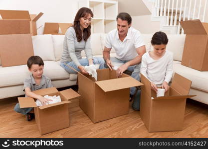 Family Unpacking Boxes Moving House