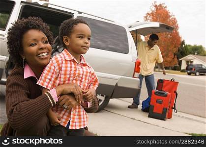 Family Unpacking Minivan