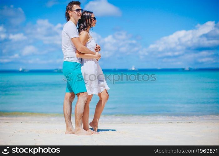 Family vacation of two on the beach vacation. Young couple on white beach during summer vacation.