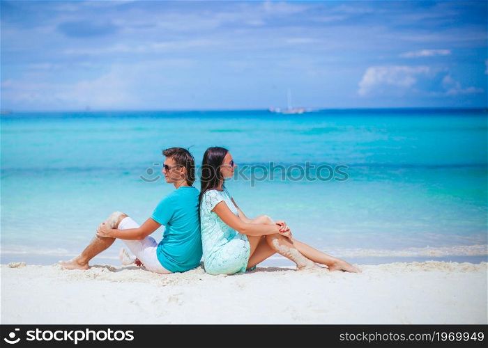 Family vacation of two on the beach vacation. Young couple on white beach during summer vacation.