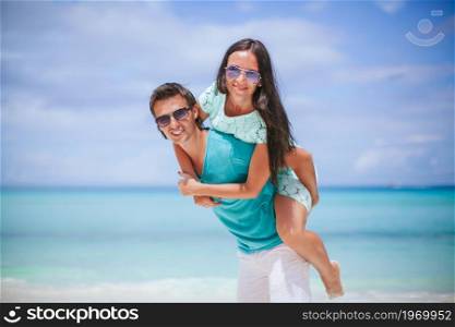 Family vacation on the beach vacation. Young couple on white beach during summer vacation.