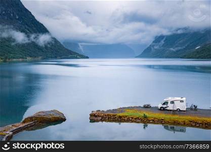 Family vacation travel RV, holiday trip in motorhome, Caravan car Vacation. Beautiful Nature Norway natural landscape.