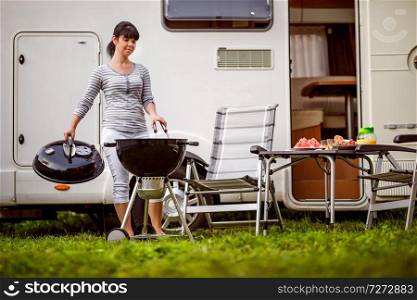 Family vacation travel RV, holiday trip in motorhome, Caravan car Vacation. Picnic with outdoor barbecue.