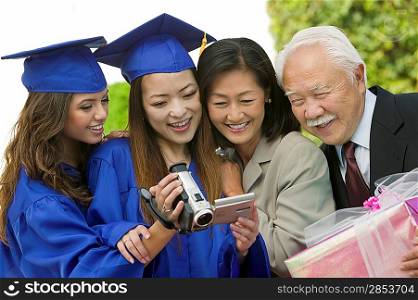 Family Videotaping Graduation