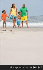 Family walking along a beach