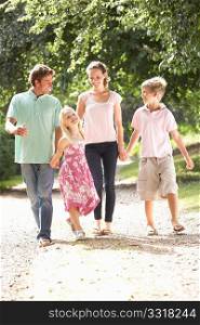 Family Walking In Countryside Together