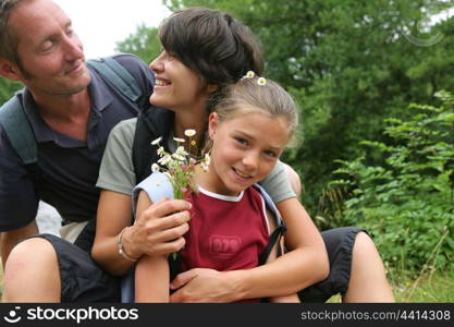 family walking in the forest