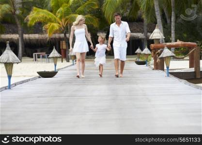 Family Walking On Wooden Jetty