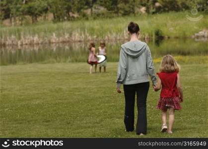 Family walking through the grass