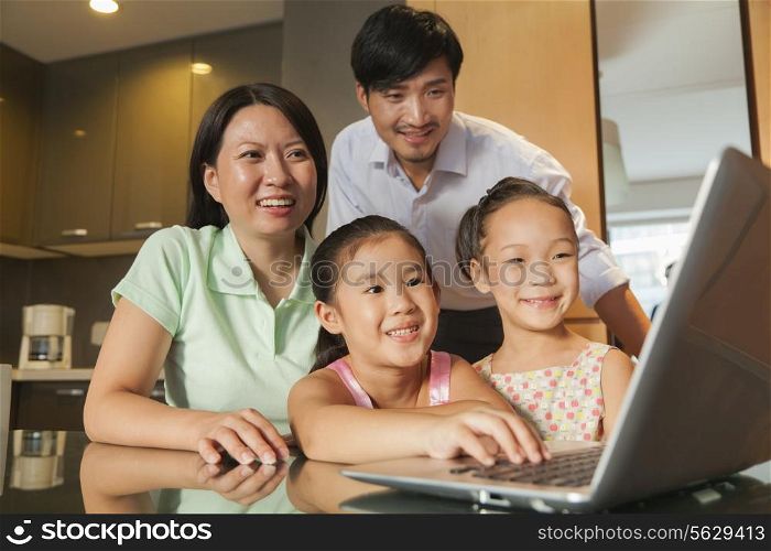 Family watching movie on the laptop