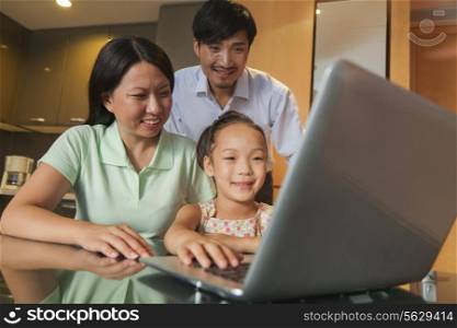 Family watching movie on the laptop