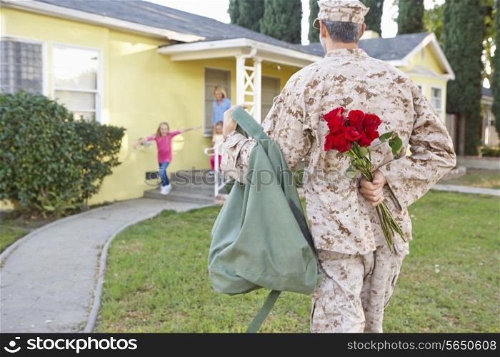 Family Welcoming Husband Home On Army Leave