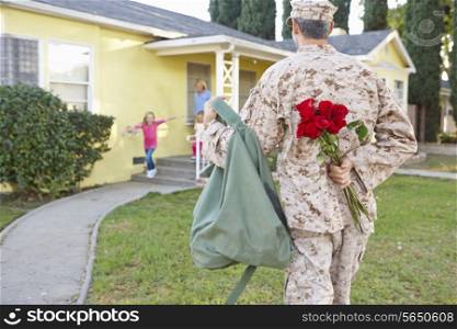 Family Welcoming Husband Home On Army Leave
