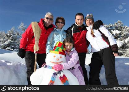 Family with a snowman