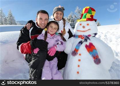 Family with a snowman