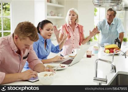 Family With Adult Children Having Argument At Breakfast
