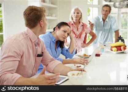 Family With Adult Children Having Argument At Breakfast