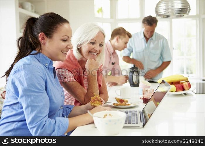Family With Adult Children Having Breakfast Together