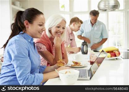 Family With Adult Children Having Breakfast Together