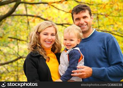 family with boy in autumn park