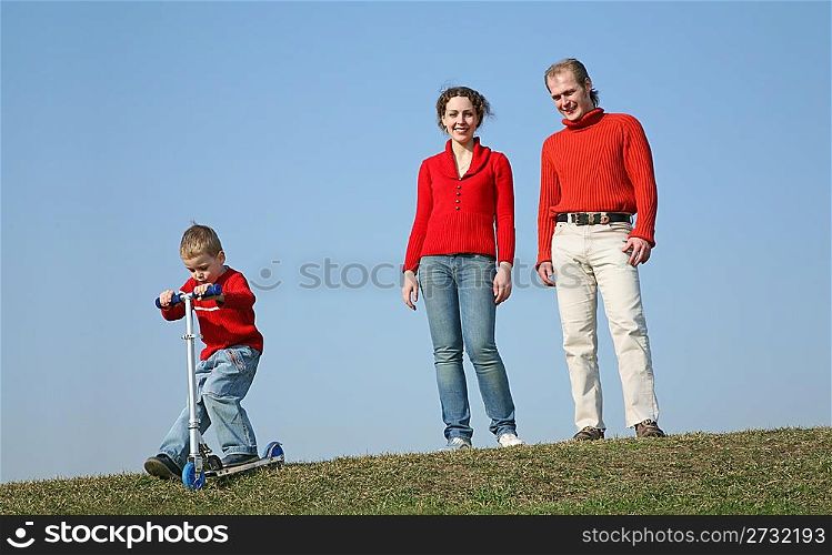 family with boy with scooter