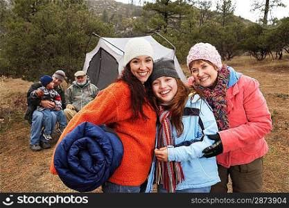 Family with children (7-12) camping (portrait)