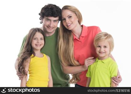 Family with children. Happy smiling family of two parents and two children isolated on white background