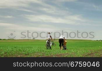 family with children having a weekend excursion on their bikes