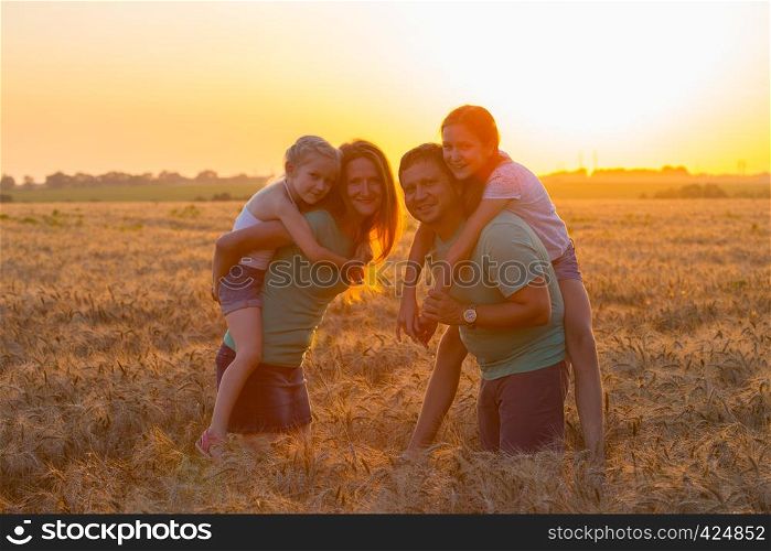 family with daughters outdoors