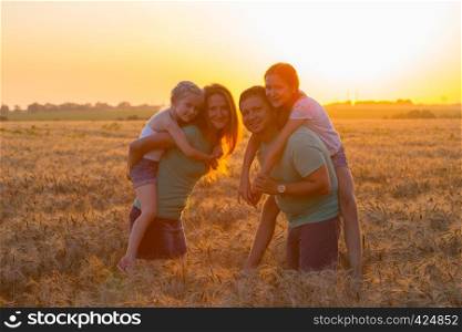 family with daughters outdoors