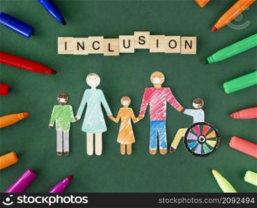 family with disables person cutout paper flat lay