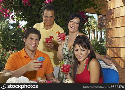 Family with drinks in garden