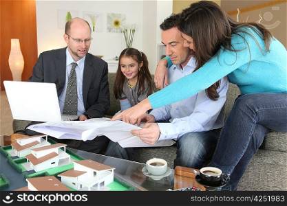 Family with estate agent