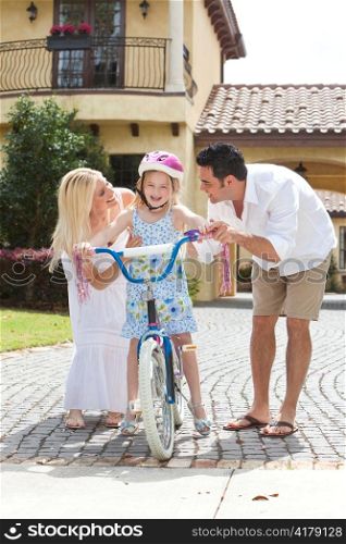 Family WIth Girl Riding Bike & Happy Parents