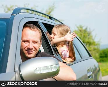 Family with kids in a car
