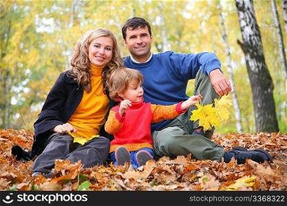 family with little girl in autumn park