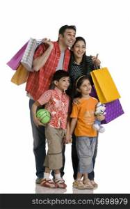 Family with shopping bags