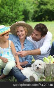 Family with small white dog