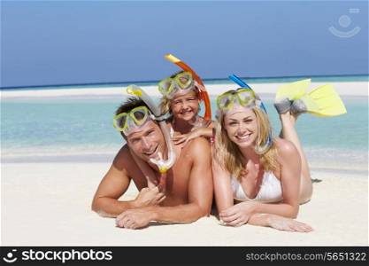 Family With Snorkels Enjoying Beach Holiday