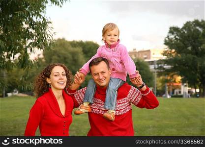 family with the daughter, who sits on the shoulders of the father 2
